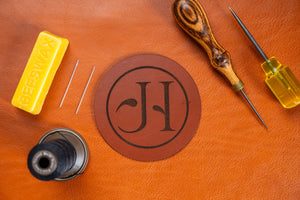 circle coaster with jhleather logo engraving