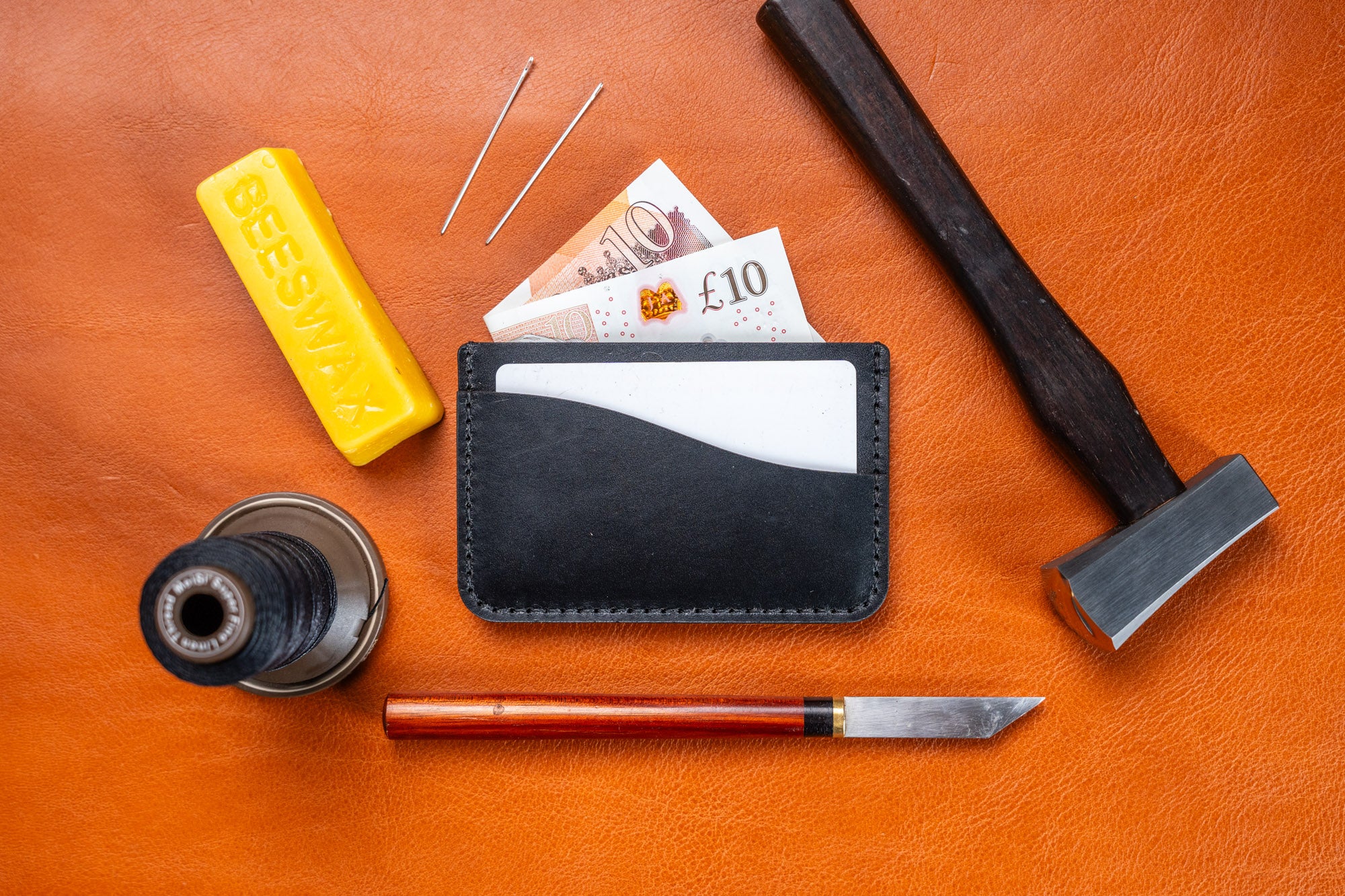 completed leather card holder showing card and cash placement